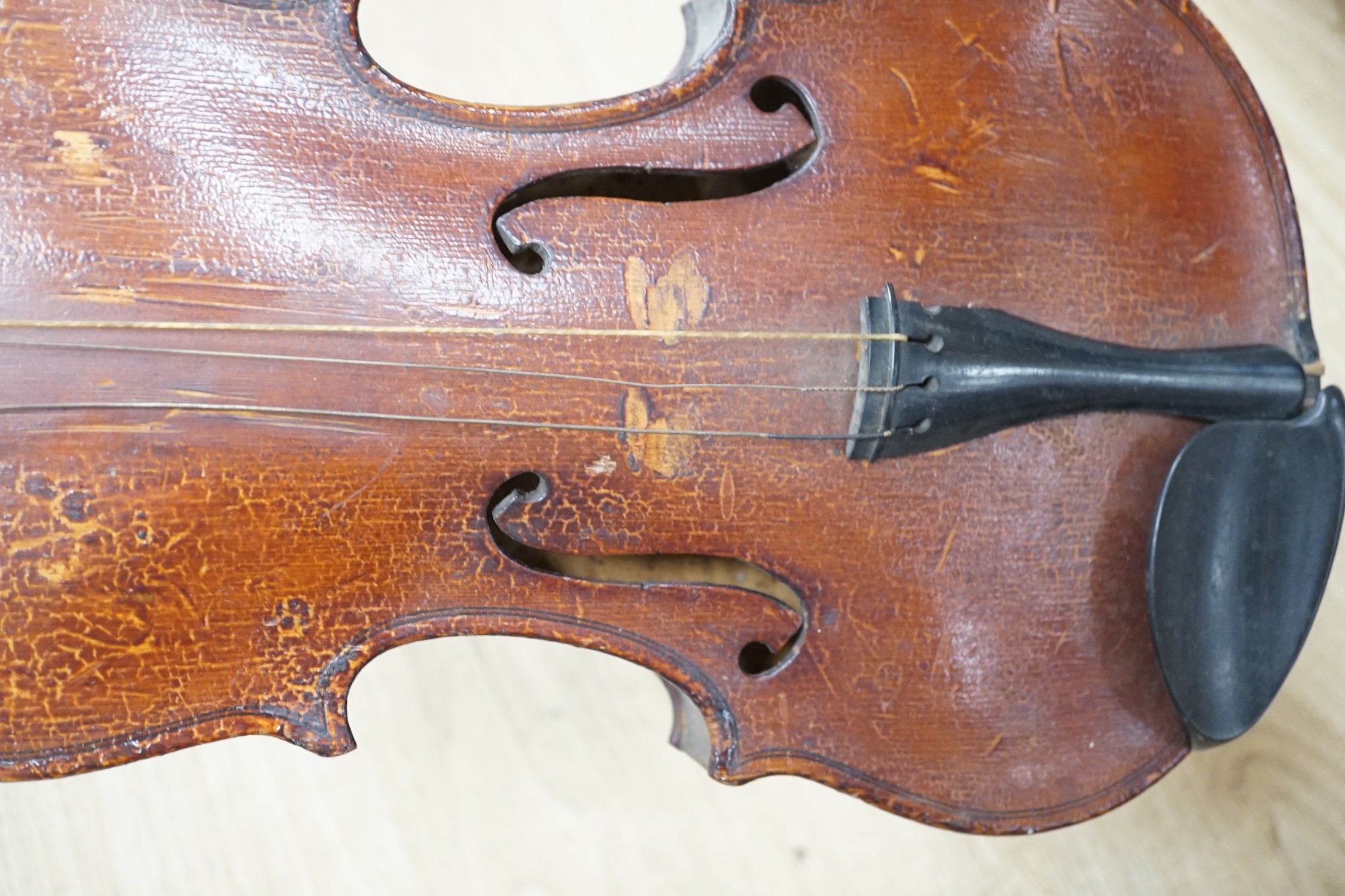 An Italian balloon back mandolin with tortoiseshell overlay, circa 1900, label for Pietro Tonelli of Napoli together with a violin, interior hand label reads ‘A.J. Newland London SW12 1939’ length of violin back excludin